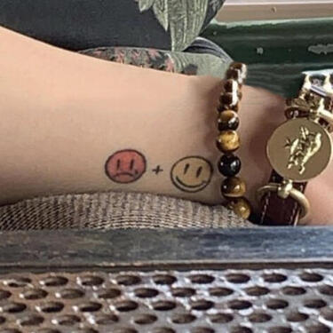 happy + sad right wrist this tattoo is about seungyoun's mental health and depression that he developed during SMTM5 and after U happy + sad right wrist this tattoo is about seungyoun's mental health and depression that he developed during SMTM5 and after U